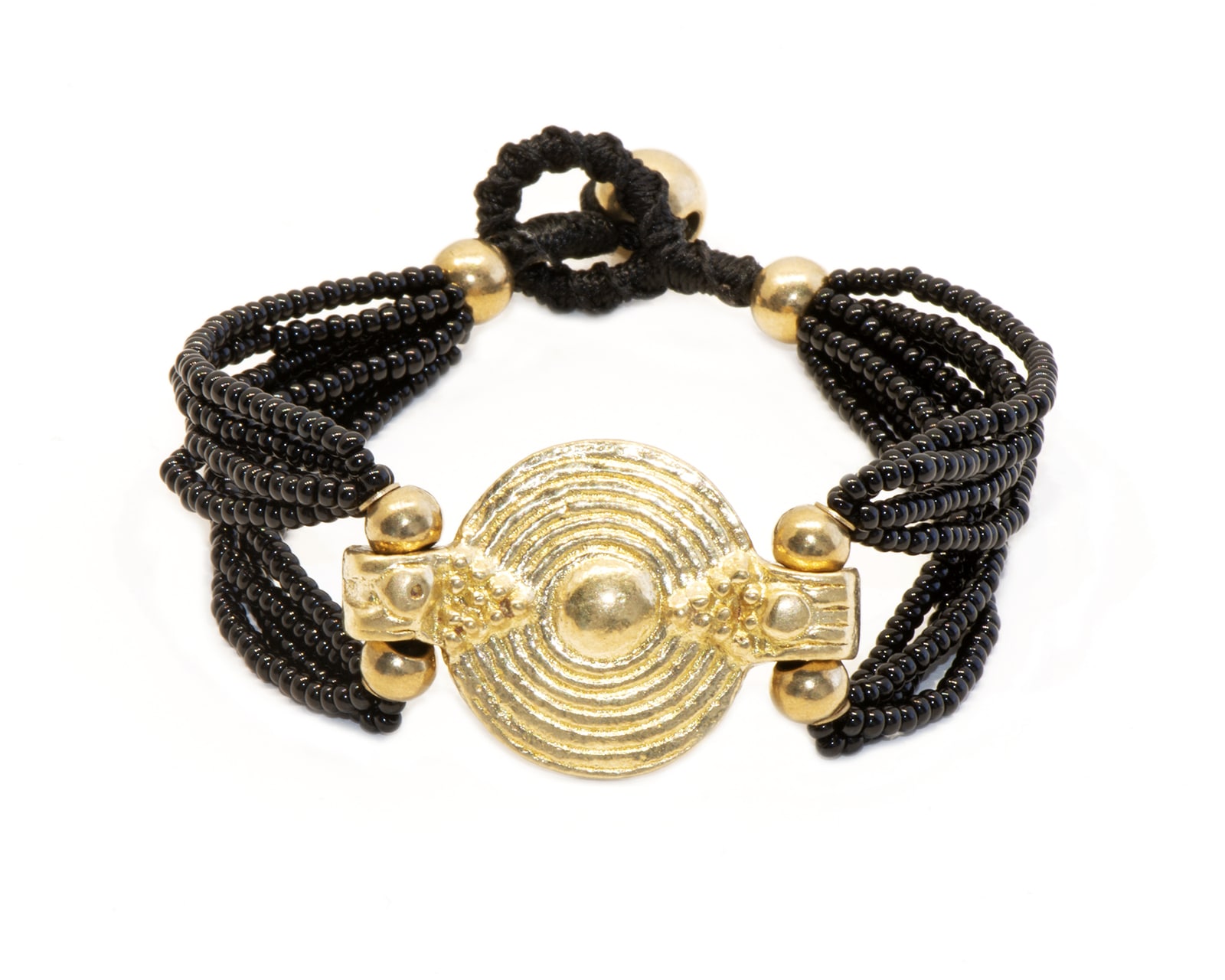 Bracelet Odissa noir avec pièce centrale en laiton doré avec spirales